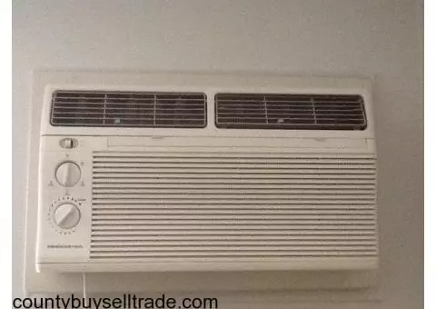Two wall unit air conditioners